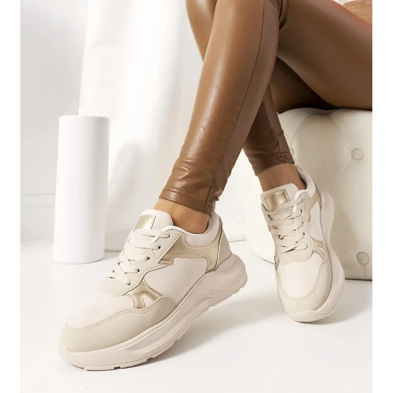 Beige sneakers with golden Davis accents